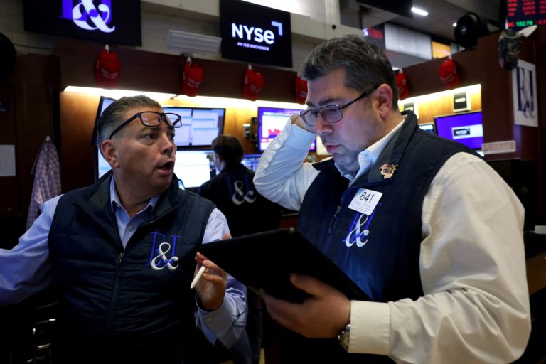 Traders work on the floor of the NYSE in New York