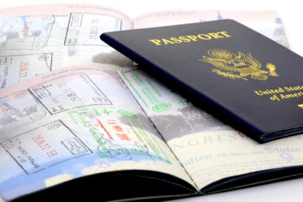 Travelers passport and international entry stamps