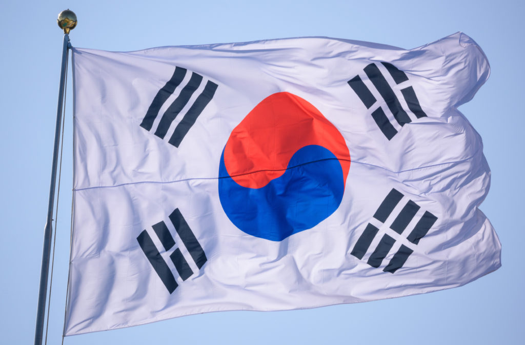 A South Korean flag is flying in the wind at the War