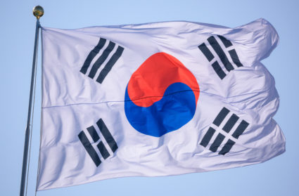 A South Korean flag is flying in the wind at the War
