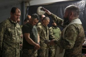 Ukrainian servicemen celebrate Easter in a front line in Donetsk region