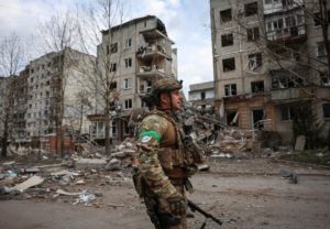 Ukrainian police officers try to persuade residents to evacuate in the frontline town of Pokrovsk