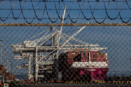 FILE PHOTO: A cargo ship full of shipping containers is seen at the port of Oakland, California