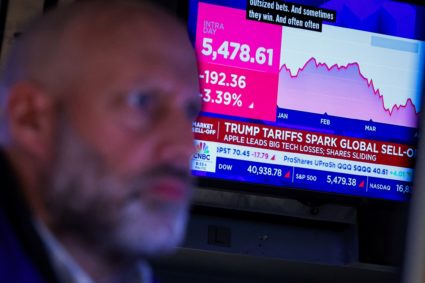 Traders work on the floor of the NYSE in New York