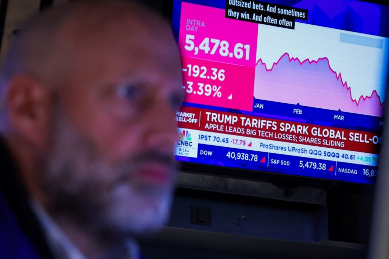 Traders work on the floor of the NYSE in New York
