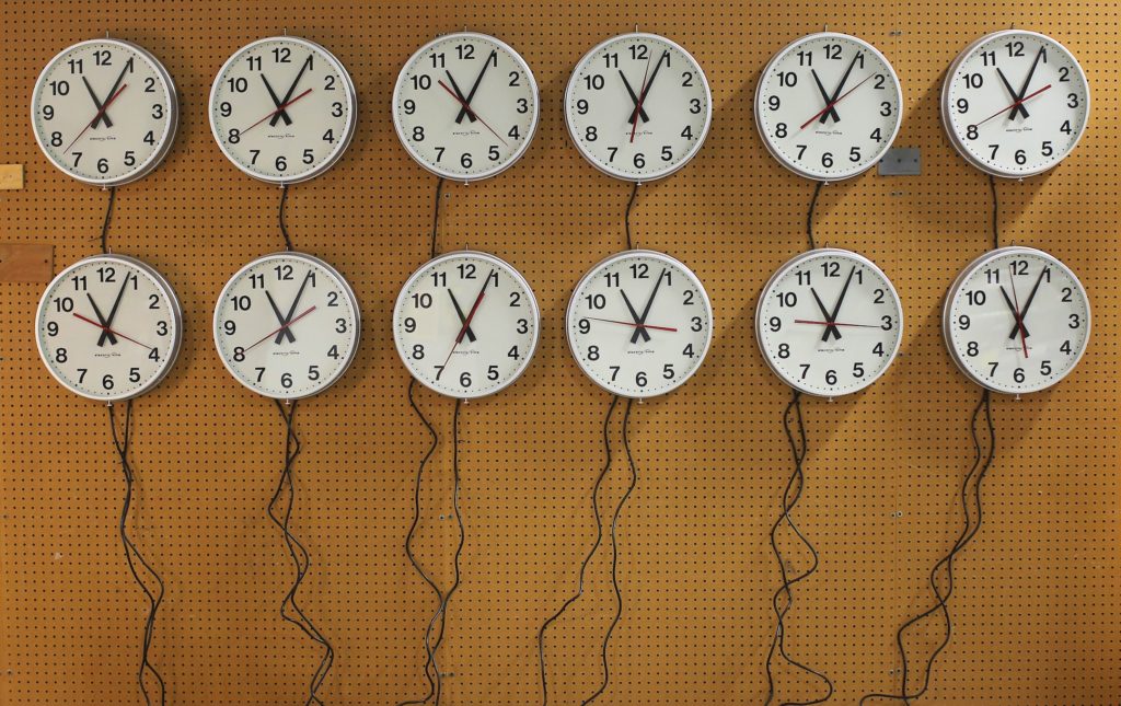 Wall clocks going to a Capital Grill restaurant are tested at the Electric Time Company in Medfield