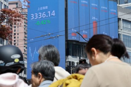 FILE PHOTO: Electronic board shows stock index in Shanghai