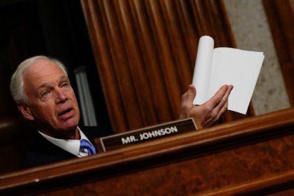 FILE PHOTO: Robert F. Kennedy Jr., testifies before a Senate Finance Committee confirmation hearing, in Washington