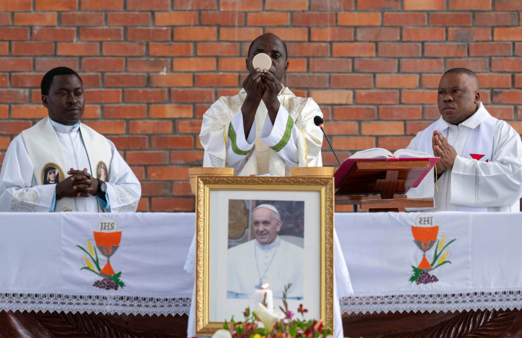 Catholic faithful take part in Requiem Mass for Pope Francis at the Bienheureuse Anuarite parish in Goma