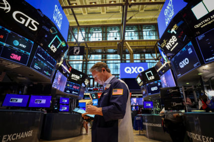 Traders work on the floor of the NYSE in New York