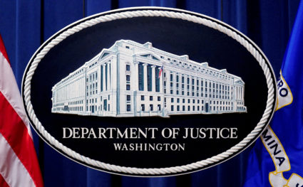 FILE PHOTO: A U.S. Justice Department logo or seal showing Justice Department headquarters, known as "Main Justice," is se...