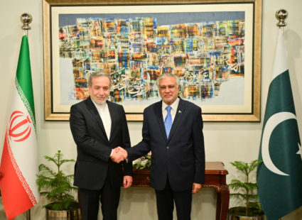 Pakistan's Foreign Minister Ishaq Dar greets Iran's Foreign Minister Abbas Araghchi upon his arrival in Islamabad