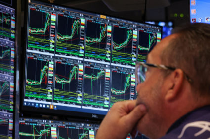 Traders work on the floor of the NYSE in New York