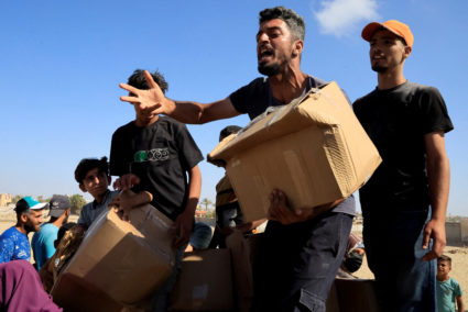 Palestinians seeking aid gather near an aid distribution site run by the U.S.-backed Gaza Humanitarian Foundation, in Rafah