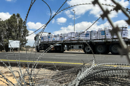 A truck carrying aid arrives at the Kerem Shalom crossing between Israel and Gaza, on its Israeli side