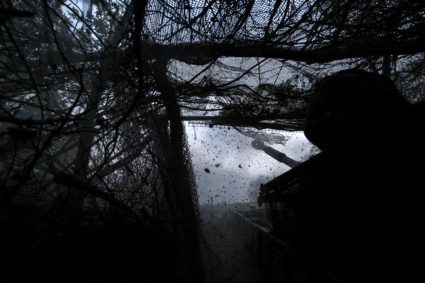 Ukrainian servicemen fire self-propelled howitzer towards Russian troops, at a position in a front line in Donetsk region