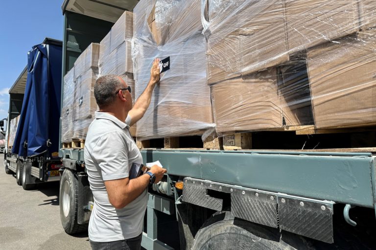 Trucks carrying aid are seen at the Kerem Shalom crossing between Israel and Gaza, on its Israeli side