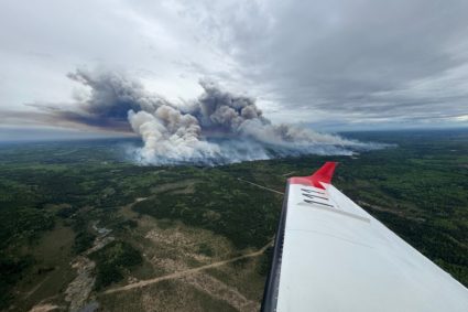 Smoke rises from the Kiskatinaw River wildfire which has prompted evacuation orders in BC