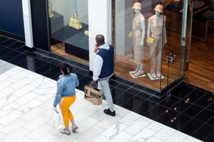 A shopper holds a Nike shopping bag, in the King of Prussia Mall in King of Prussia