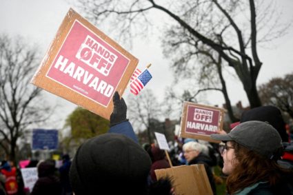 FILE PHOTO: Demonstrators rally on Cambridge Common in a protest organized by the City of Cambridge against interference b...
