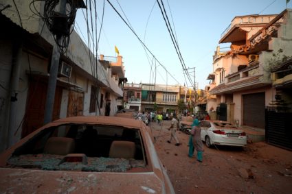 Damaged vehicles are seen in the neighbourhood, following Pakistan's military operation against India, in Rehari, Jammu
