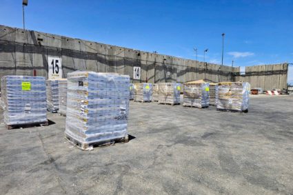 Boxes of aid are seen at the Kerem Shalom crossing between Israel and Gaza, on its Israeli side