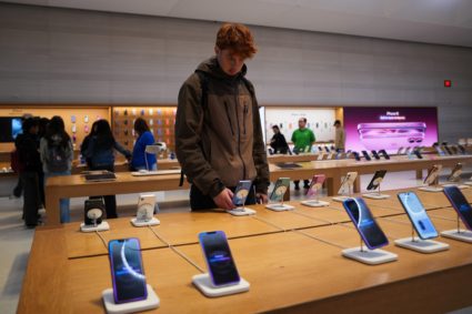 People visit Apple's Fifth Avenue store in New York City