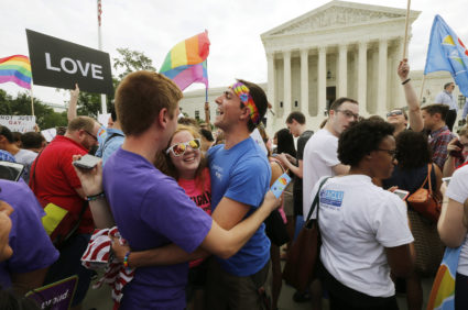 Gay rights supporters celebrate outside the U.S. Supreme Court building in Washington