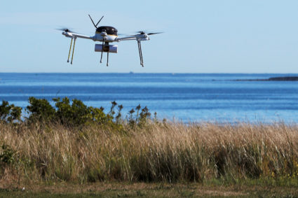 A drone, made by CyPhy Works, delivers a UPS package on Children's Island off the coast of Beverly