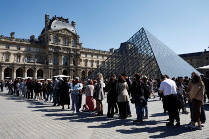 Tourists at the Louvre Museum in Paris
