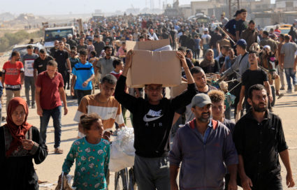 Palestinians seeking aid gather near an aid distribution site run by the U.S.-backed Gaza Humanitarian Foundation, in Rafah