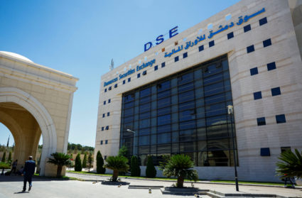 A man walks near Damascus Securities Exchange building in Damascus