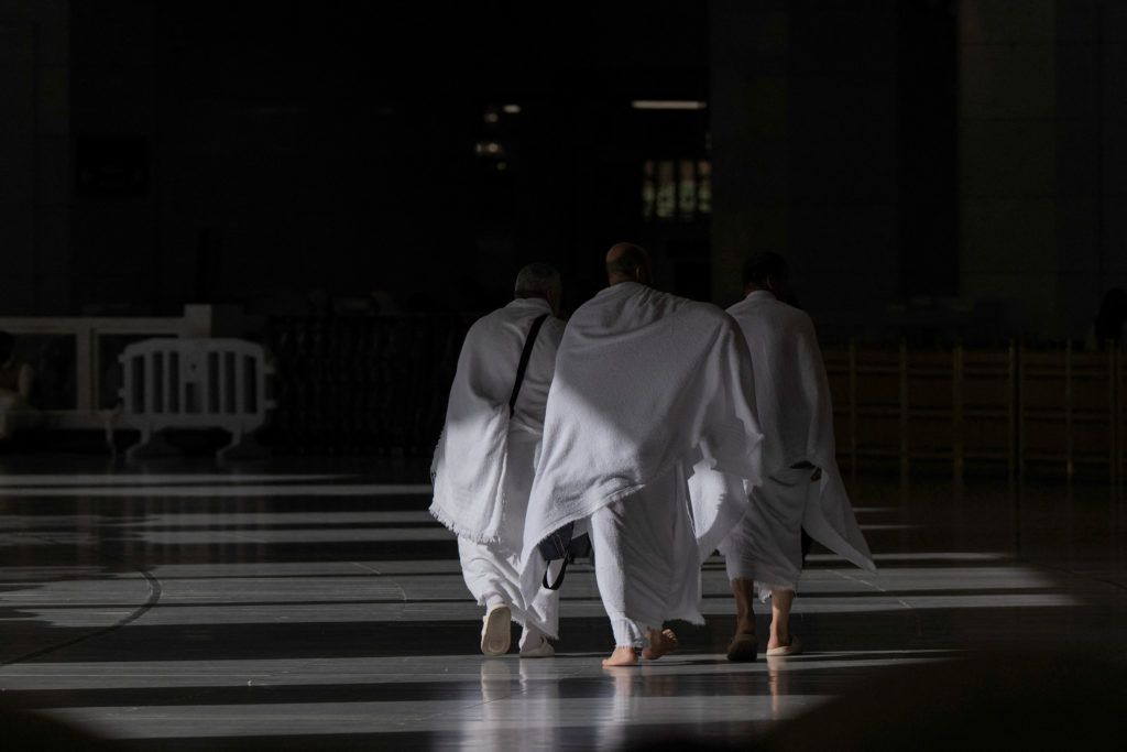People walk as they arrive at the grand mosque during the annual hajj pilgrimage in the holy city of Mecca