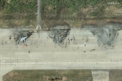 A satellite image shows destroyed aircrafts in the aftermath of a drone strike at the Olenya air base