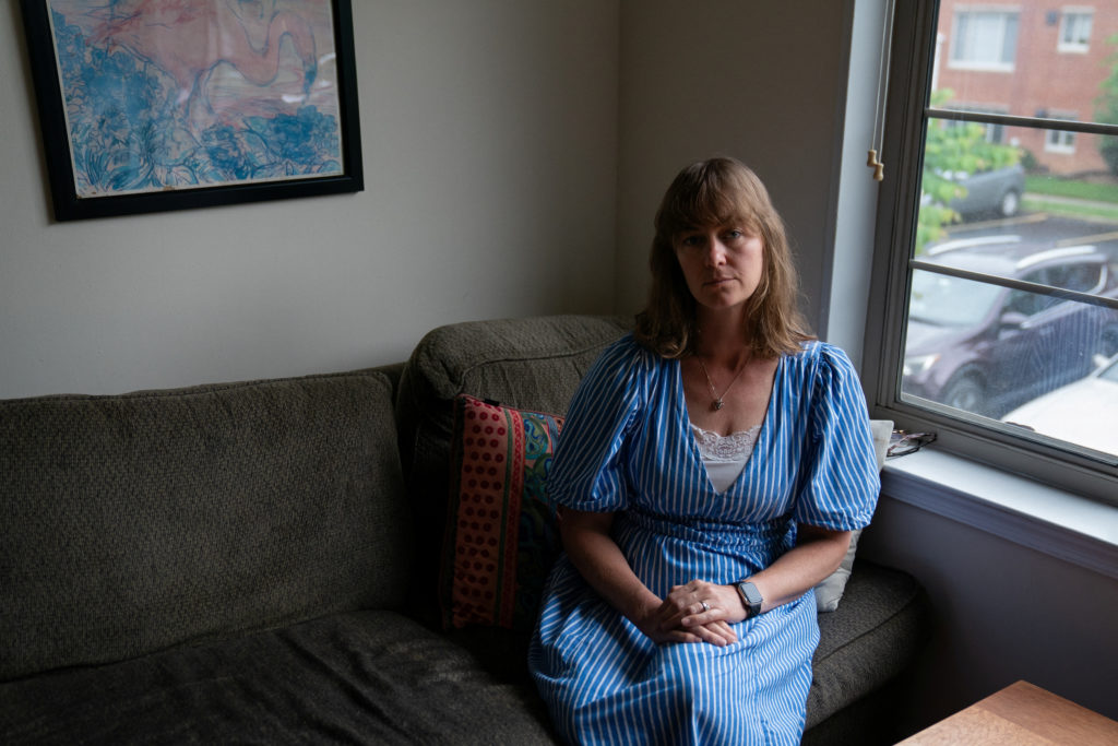 Jenna Norton, an employee at the National Institute of Diabetes and Digestive and Kidney Diseases, sits for a portrait in ...