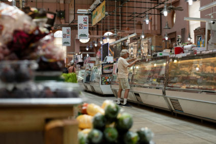 FILE PHOTO: People shop for groceries at Eastern Market in Washington
