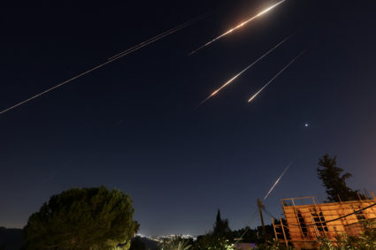 Iran launches scores of ballistic missiles in retaliation against Israel's attack on Tehran