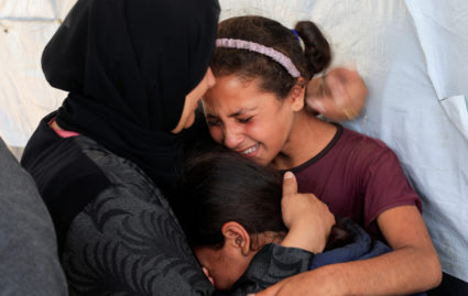 Witnesses say gunfire from Israeli forces killed 8, wounded dozens near aid sites in Gaza