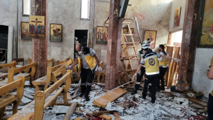 Civil defence members inspect the damage after a blast rocked the Mar Elias Church according to witnesses, in the Dweila n...