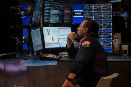 A trader works at the New York Stock Exchange (NYSE) in New York City