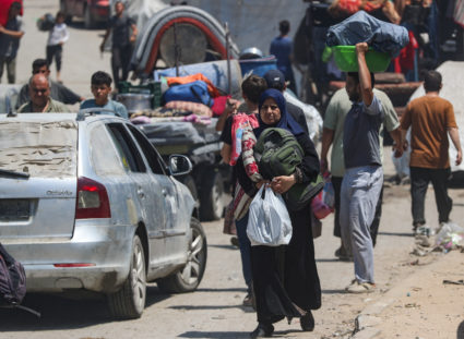 Palestinians flee their homes after the Israeli army issued evacuation orders, in Gaza City