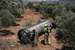Israeli special force check the apparent remains of a ballistic missile before it will be evacuated from the location it w...