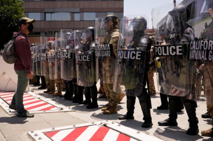 Members of the California National Guard stand guard in downtown Los Angeles