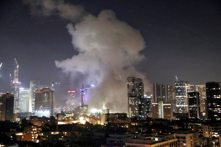 Smoke billows following missile attack from Iran on Israel, at Tel Aviv, Israel