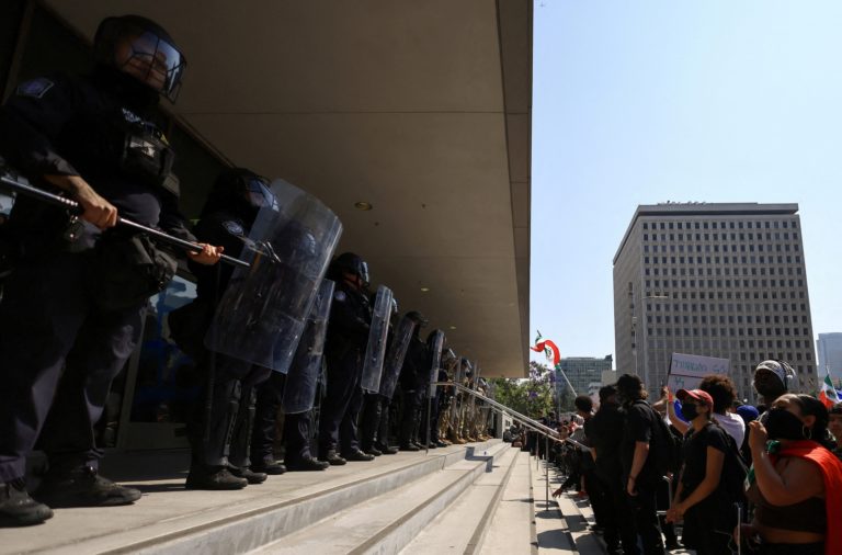 FILE PHOTO: California National Guard troops stand outside the Edward R. Roybal Federal Building, in Los Angeles