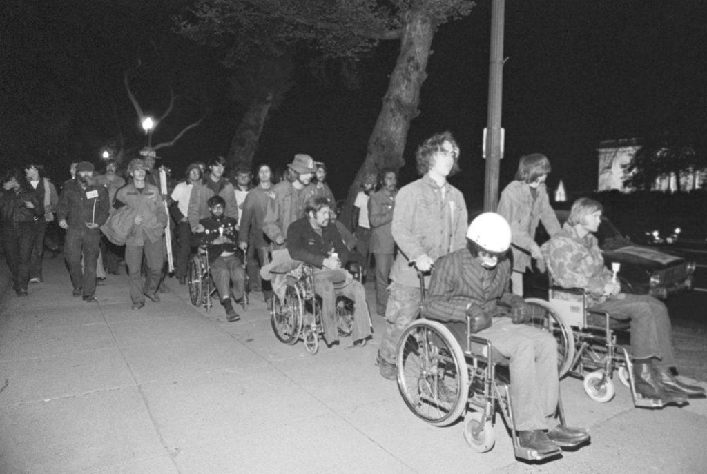 Vietnam Viets Being Pushed in Wheelchairs