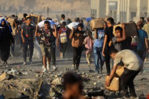 Palestinians receive aid supplies in Beit Lahia