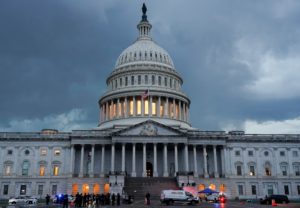 Protesters are detained after breaking through barrier fencing on Capitol Hill in Washington, D.C.