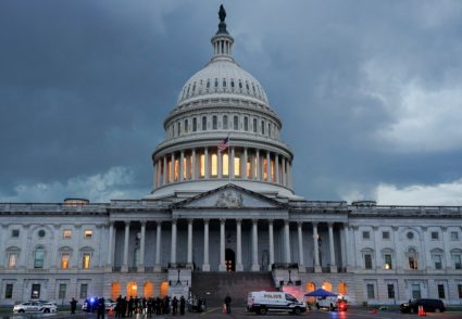 Protesters are detained after breaking through barrier fencing on Capitol Hill in Washington, D.C.