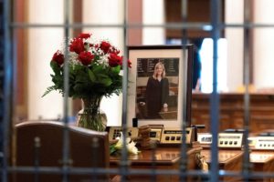 Flowers and a portrait of slain Democratic state lawmaker Melissa Hortman lie on Hortman’s desk in the Minnesota House Cha...